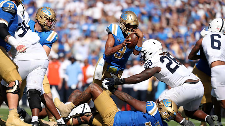 Oct 4, 2025; Pasadena, California, USA;  UCLA Bruins quarterback Nico Iamaleava (9) scores a touchdown on 1 yard run during the third quarter against the Penn State Nittany Lions at Rose Bowl. Mandatory Credit: Kiyoshi Mio-Imagn Images