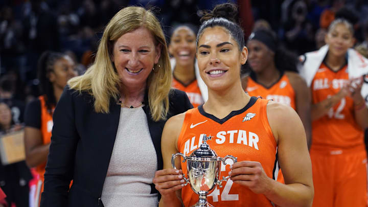 Jul 10, 2022; Chicago, Ill, USA; WNBA commissioner Cathy Engelbert presents the WNBA All Star Game MVP Award to Team Wilson guard Kelsey Plum at Wintrust Arena. Mandatory Credit: David Banks-Imagn Images