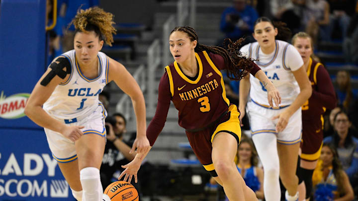 Feb 2, 2025; Los Angeles, California, USA; Minnesota Golden Gophers guard Amaya Battle (3) dribbles the ball up the court between UCLA Bruins guard Kiki Rice (1) and Lauren Betts (51) during the second quarter at Pauley Pavilion presented by Wescom. Mandatory Credit: Robert Hanashiro-Imagn Images Feb 2, 2025; Los Angeles, California, USA; Minnesota Golden Gophers guard Amaya Battle (3) dribbles the ball up the court between UCLA Bruins guard Kiki Rice (1) and Lauren Betts (51) during the second quarter at Pauley Pavilion presented by Wescom. Mandatory Credit: Robert Hanashiro-Imagn Images