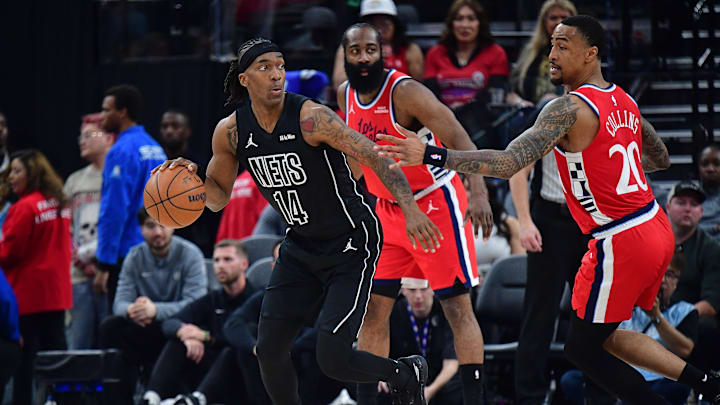 Jan 25, 2026; Inglewood, California, USA; Brooklyn Nets guard Terance Mann (14) moves the ball against Los Angeles Clippers forward John Collins (20) during the first half at Intuit Dome. Mandatory Credit: Gary A. Vasquez-Imagn Images