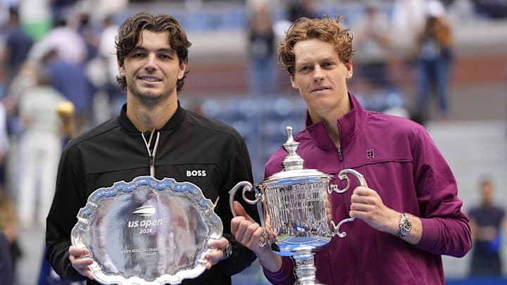 Sep 8, 2024; Flushing, NY, USA; Jannik Sinner (ITA) and Taylor Fritz (USA) pose for a photo with trophies after the men’s singles final of the 2024 U.S. Open tennis tournament at USTA Billie Jean King National Tennis Center. Sep 8, 2024; Flushing, NY, USA; Jannik Sinner (ITA) and Taylor Fritz (USA) pose for a photo with trophies after the men’s singles final of the 2024 U.S. Open tennis tournament at USTA Billie Jean King National Tennis Center.