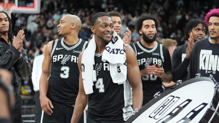 Jan 17, 2026; San Antonio, Texas, USA; San Antonio Spurs guard De'aaron Fox (4) gets ready to beat the drum after the game against the Minnesota Timberwolves at Frost Bank Center. Mandatory Credit: Daniel Dunn-Imagn Images