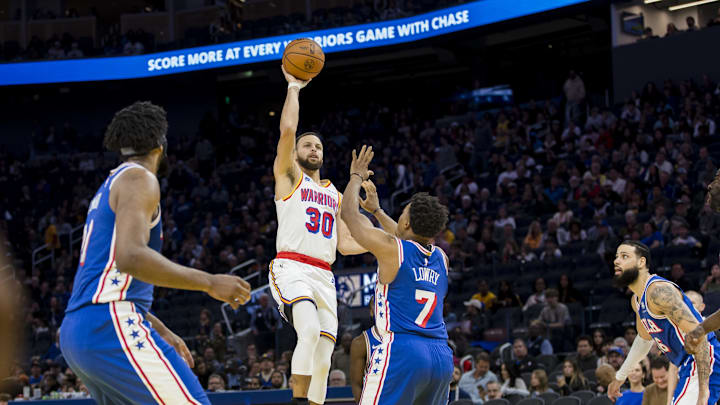 Jan 2, 2025; San Francisco, California, USA; Golden State Warriors guard Stephen Curry (30) shoots over Philadelphia 76ers guard Kyle Lowry (7) during the third quarter at Chase Center. Mandatory Credit: John Hefti-Imagn Images