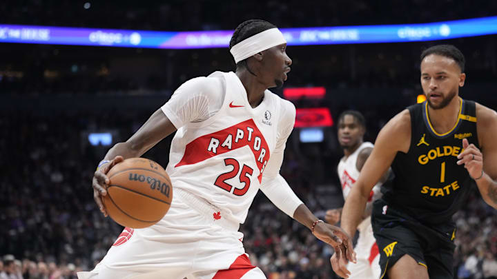Jan 13, 2025; Toronto, Ontario, CAN; Toronto Raptors forward Chris Boucher (25) drives to the net against Golden State Warriors forward Kyle Anderson (1) during the first half at Scotiabank Arena. Mandatory Credit: John E. Sokolowski-Imagn Images