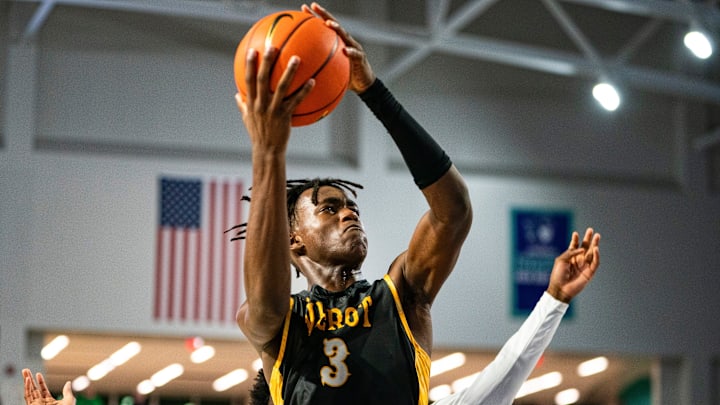 Bishop Verot Vikings forward Jerry Ashley (3) goes up for a lay up during the fourth quarter of the Hugh Thimlar tribute game against the Fort Myers Green Wave during the 50th annual City of Palms Classic at Suncoast Credit Union Arena in Fort Myers on Wednesday, Dec. 20, 2023.