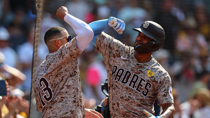 Sep 8, 2024; San Diego, California, USA; San Diego Padres second baseman Xander Bogaerts (2) celebrates with third baseman Manny Machado (13) after hitting a two run home run during the eighth inning against the San Francisco Giants at Petco Park. Mandatory Credit: Chadd Cady-Imagn Images