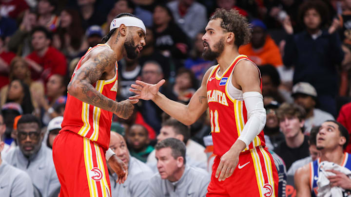 Dec 27, 2025; Atlanta, Georgia, USA; Atlanta Hawks guard Trae Young (11) celebrates after a basket with guard Nickeil Alexander-Walker (7) against the New York Knicks in the third quarter at State Farm Arena. Mandatory Credit: Brett Davis-Imagn Images