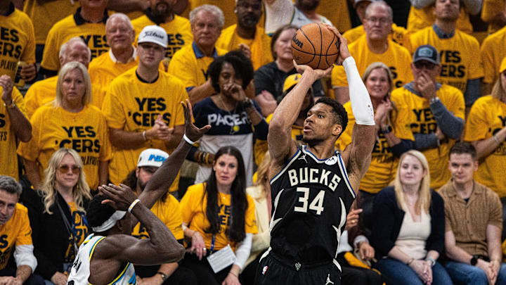 Apr 29, 2025; Indianapolis, Indiana, USA: Milwaukee Bucks forward Giannis Antetokounmpo (34) shoots the ball while  Indiana Pacers forward Pascal Siakam (43) defends during game five of the first round for the 2024 NBA Playoffs at Gainbridge Fieldhouse. Mandatory Credit: Trevor Ruszkowski-Imagn Images