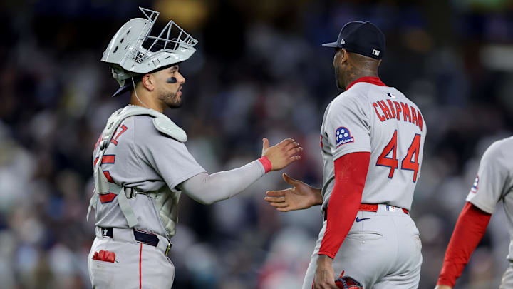 Jun 7, 2025; Bronx, New York, USA; Boston Red Sox catcher Carlos Narvaez (75) and relief pitcher Aroldis Chapman (44) celebrate after defeating the New York Yankees at Yankee Stadium. Mandatory Credit: Brad Penner-Imagn Images