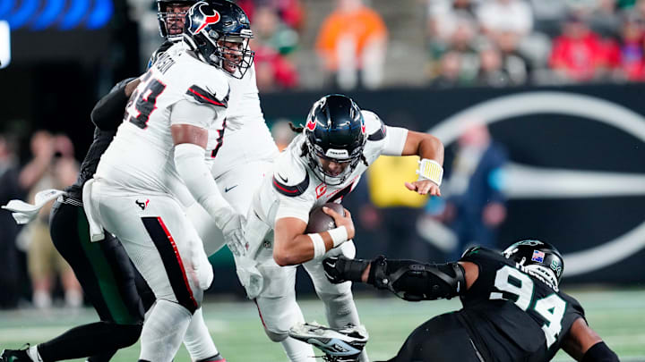 Houston Texans quarterback C.J. Stroud (7) goes down in in the second quarter before being helped off the field, Thursday, October 31, 2024, in East Rutherford.