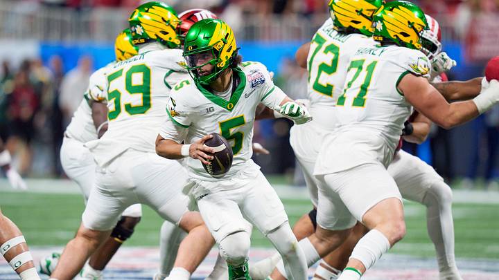 Oregon quarterback Dante Moore drops back as the Oregon Ducks face the Indiana Hoosiers in the Peach Bowl on Jan. 9, 2026, at Mercedes-Benz Stadium in Atlanta, Georgia.