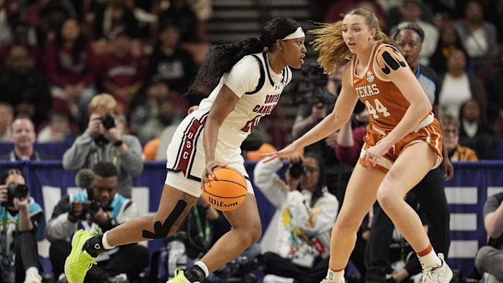 March 9, 2025; Greenville, SC, USA; South Carolina Gamecocks forward Sania Feagin (20) handles the ball against Texas Longhorns forward Taylor Jones (44).