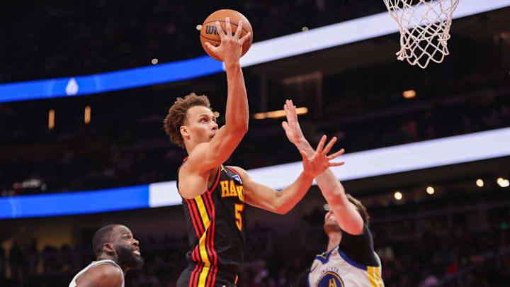 Mar 21, 2026; Atlanta, Georgia, USA; Atlanta Hawks guard Dyson Daniels (5) shoots against the Golden State Warriors in the first quarter at State Farm Arena. Mandatory Credit: Brett Davis-Imagn Images
