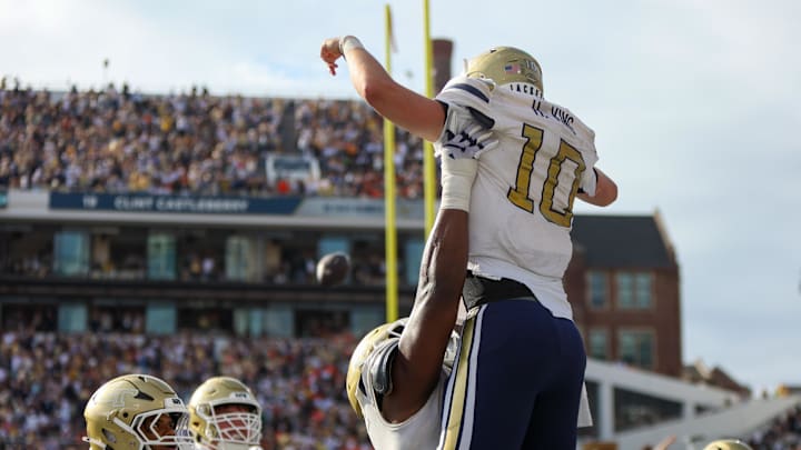 Nov 9, 2024; Atlanta, Georgia, USA; Georgia Tech Yellow Jackets quarterback Haynes King (10) celebrates after a touchdown against the Miami Hurricanes in the fourth quarter at Bobby Dodd Stadium at Hyundai Field. Mandatory Credit: Brett Davis-Imagn Images