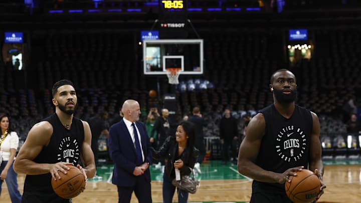 Apr 4, 2025; Boston, Massachusetts, USA; Boston Celtics forward Jayson Tatum (0) and guard Jaylen Brown (7) warm up before their game against the Phoenix Suns at TD Garden. Mandatory Credit: Winslow Townson-Imagn Images