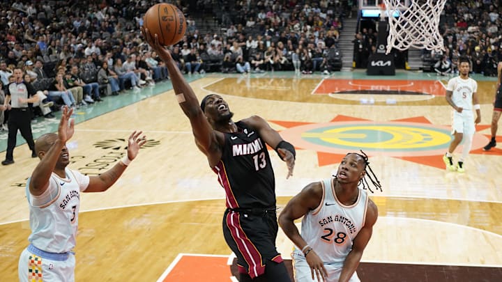 Feb 1, 2025; San Antonio, Texas, USA; Miami Heat center Bam Adebayo (13) drives to the basket against San Antonio Spurs center Charles Bassey (28) during the first half at Frost Bank Center. Mandatory Credit: Scott Wachter-Imagn Images