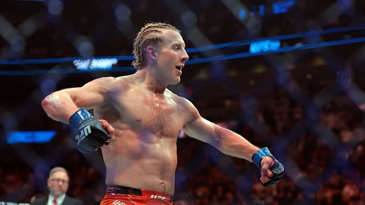 Apr 12, 2025; Miami, Florida, UNITED STATES;  Paddy Pimblett (blue gloves) reacts after defeating Michael Chandler (not pictured) during UFC 314 at Kaseya Center. Mandatory Credit: Sam Navarro-Imagn Images