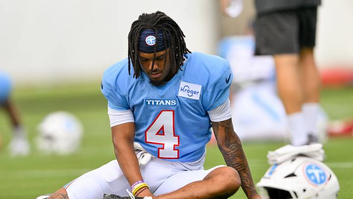 Aug 3, 2026; Nashville, TN, USA;  Tennessee Titans wide receiver Wan'Dale Robinson (4) stretches during training camp at Vanderbilt Health Football Center. Mandatory Credit: Steve Roberts-Imagn Images