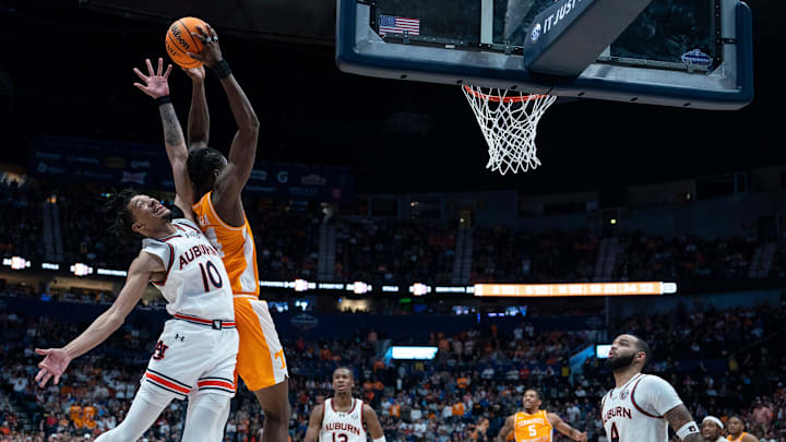 Auburn guard Chad Baker-Mazara (10) and Tennessee forward Felix Okpara (34) go up for a lob pass during the second half of their quarterfinal game of the SEC Men's Basketball Tournament at Bridgestone Arena in Nashville, Tenn., Saturday, March 15, 2025.