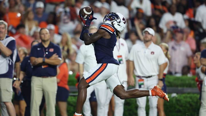 Sep 6, 2025; Auburn, Alabama, USA;  Auburn Tigers wide receiver Eric Singleton Jr. (1) catches a pass and scores a touchdown against the Ball State Cardinals during the second quarter at Jordan-Hare Stadium. Mandatory Credit: John Reed-Imagn Images