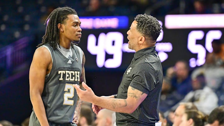 Jan 28, 2025; South Bend, Indiana, USA; Georgia Tech Yellow Jackets head coach Damon Stoudamire talks to guard Javian McCollum (2) in the second half against the Notre Dame Fighting Irish at the Purcell Pavilion. Mandatory Credit: Matt Cashore-Imagn Images