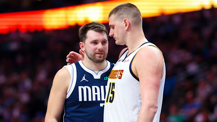 Mar 17, 2024; Dallas, Texas, USA;  Dallas Mavericks guard Luka Doncic (77) speaks with Denver Nuggets center Nikola Jokic (15) during the second half at American Airlines Center. Mandatory Credit: Kevin Jairaj-Imagn Images