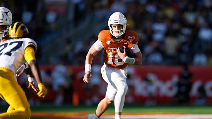 Dec 31, 2025; Orlando, FL, USA; Texas Longhorns quarterback Arch Manning (16) runs with the ball against the Michigan Wolverines during the first half at Camping World Stadium. Mandatory Credit: Matt Pendleton-Imagn Images 