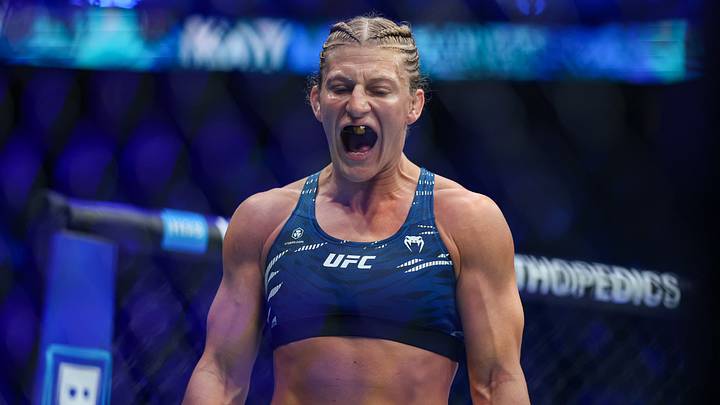 Jun 7, 2025; Newark, New Jersey, UNITED STATES; Kayla Harrison (blue gloves) prepares to fight Julianna Pena (not pictured) in a bantamweight title bout during UFC 316 at Prudential Center. Mandatory Credit: Vincent Carchietta-Imagn Images Jun 7, 2025; Newark, New Jersey, UNITED STATES; Kayla Harrison (blue gloves) prepares to fight Julianna Pena (not pictured) in a bantamweight title bout during UFC 316 at Prudential Center. Mandatory Credit: Vincent Carchietta-Imagn Images