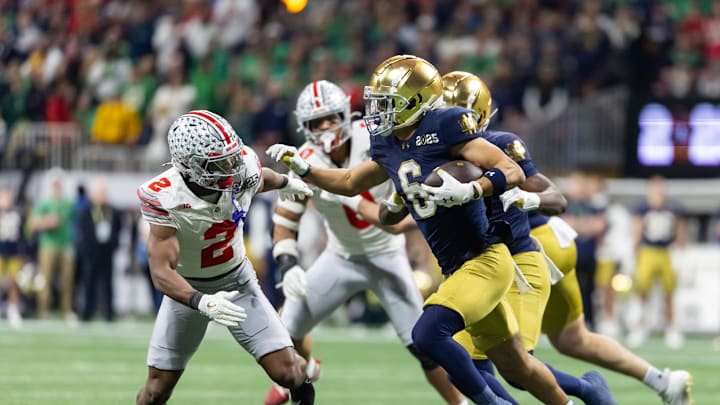 Jan 20, 2025; Atlanta, GA, USA; Notre Dame Fighting Irish wide receiver Jordan Faison (6) against Ohio State Buckeyes safety Caleb Downs (2) during the CFP National Championship college football game at Mercedes-Benz Stadium. Mandatory Credit: Mark J. Rebilas-Imagn Images
