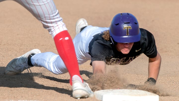 Tokay's Brock Sell dives back to first on a pickoff attempt during a varsity baseball game against Tokay at Lincoln in Stockton on Wednesday, Apr.19, 2023.

Bb Tokay Linc 248a