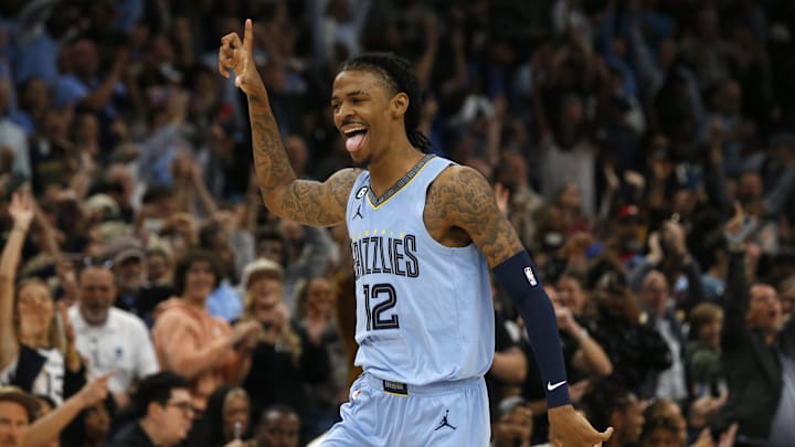 Memphis Grizzlies guard Ja Morant (12) reacts after a basket during the second half against the Brooklyn Nets at FedExForum. Mandatory Credit: Petre Thomas-Imagn Images