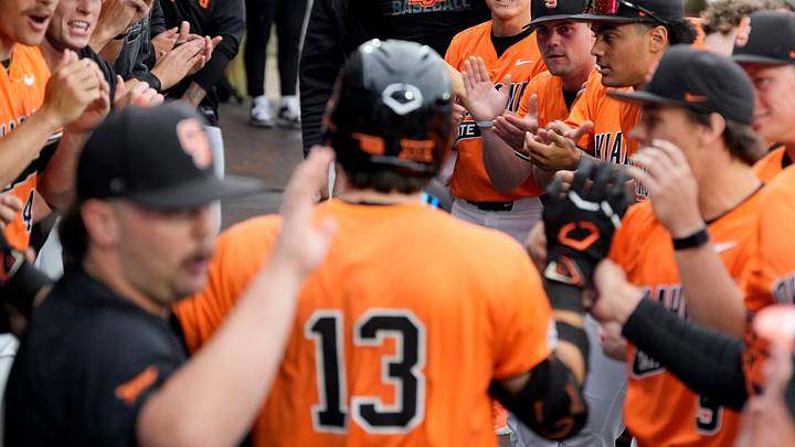 Oklahoma State players greet Oklahoma State Cowboys infielder Kollin Ritchie. Oklahoma State players greet Oklahoma State Cowboys infielder Kollin Ritchie.