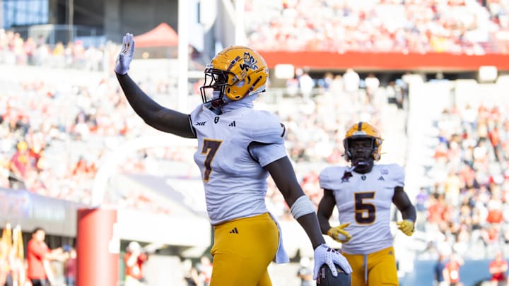 Nov 30, 2024; Tucson, Arizona, USA; Arizona State Sun Devils tight end Chamon Metayer (7) waves to the fans as he celebrates a touchdown against the Arizona Wildcats during the Territorial Cup at Arizona Stadium. Mandatory Credit: Mark J. Rebilas-Imagn Images