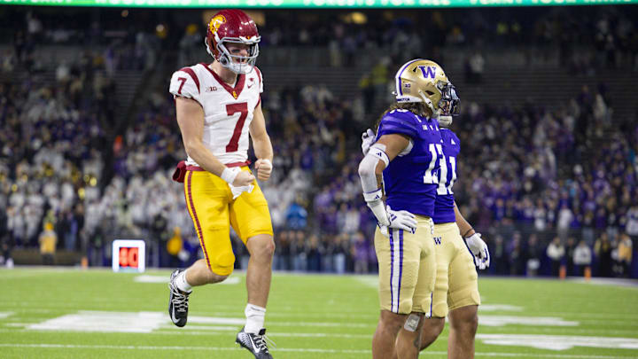 Nov 2, 2024; Seattle, Washington, USA; USC Trojans quarterback Miller Moss (7) celebrates after throwing a touchdown pass against the Washington Huskies during the third quarter at Alaska Airlines Field at Husky Stadium. Mandatory Credit: Joe Nicholson-Imagn Images