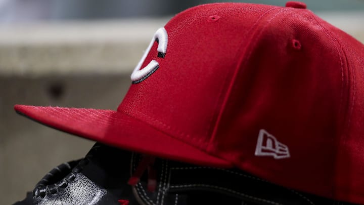 The hat and glove of Cincinnati Reds right fielder Tyler Naquin (12) during the sixth inning in the game against the New York Mets at Great American Ball Park in 2022.