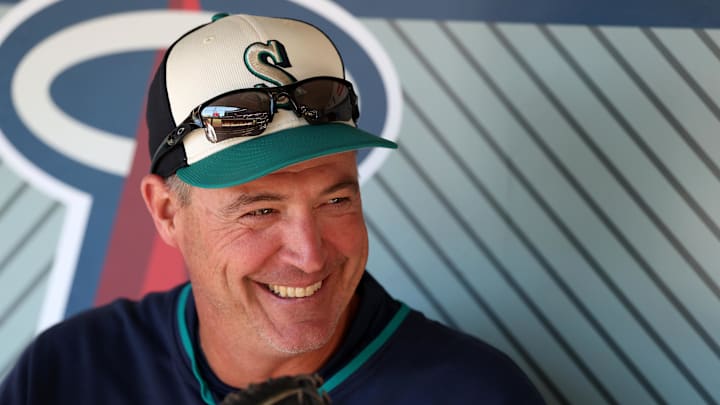 Seattle Mariners manager Dan Wilson (6) smiles in the dugout before the game against the Los Angeles Angels at Angel Stadium on July 25. Seattle Mariners manager Dan Wilson (6) smiles in the dugout before the game against the Los Angeles Angels at Angel Stadium on July 25.