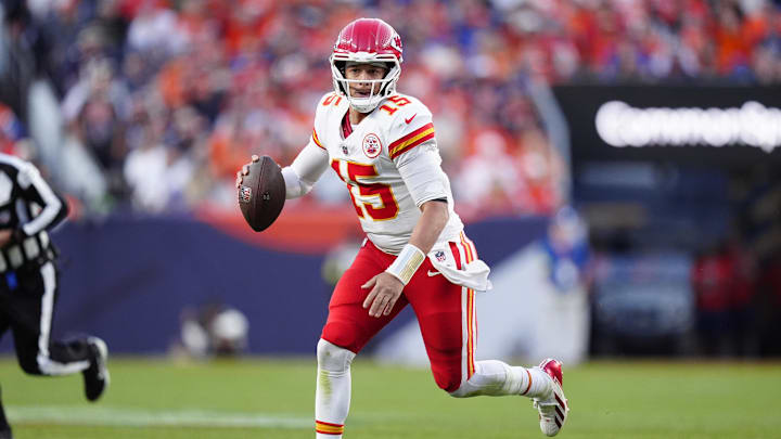 Nov 16, 2025; Denver, Colorado, USA; Kansas City Chiefs quarterback Patrick Mahomes (15) scrambles with the ball in the third quarter against the Denver Broncos at Empower Field at Mile High. Mandatory Credit: Ron Chenoy-Imagn Images