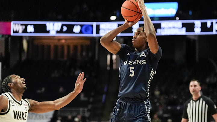 Queens University Royals forward Kam Clark (5) shoots. Queens University Royals forward Kam Clark (5) shoots.
