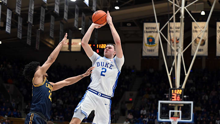 Feb 12, 2025; Durham, North Carolina, USA; Duke Blue Devils forward Cooper Flagg (2) shoots over California Golden Bears guard Christian Tucker (22) during the second half at Cameron Indoor Stadium. Mandatory Credit: Rob Kinnan-Imagn Images