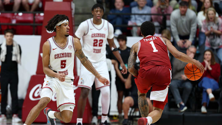 Feb 18, 2026; Tuscaloosa, Alabama, USA; Arkansas Razorback guard Meleek Thomas (1) dribbles against Alabama Crimson Tide forward Amari Allen (5) during the second half at Coleman Coliseum. Mandatory Credit: David Leong-Imagn Images Feb 18, 2026; Tuscaloosa, Alabama, USA; Arkansas Razorback guard Meleek Thomas (1) dribbles against Alabama Crimson Tide forward Amari Allen (5) during the second half at Coleman Coliseum. Mandatory Credit: David Leong-Imagn Images