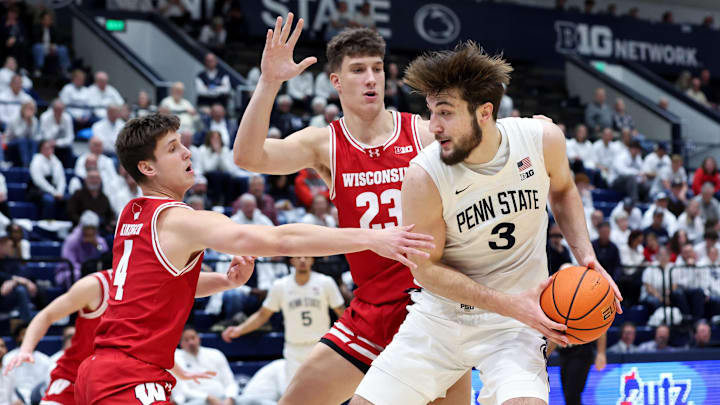 Jan 22, 2026; University Park, Pennsylvania, USA; Penn State Nittany Lions forward Ivan Juric (3) holds the ball as Wisconsin Badgers guard Zach Kinziger (4) and forward Will Garlock (23) defend during the second half at Rec Hall. Jan 22, 2026; University Park, Pennsylvania, USA; Penn State Nittany Lions forward Ivan Juric (3) holds the ball as Wisconsin Badgers guard Zach Kinziger (4) and forward Will Garlock (23) defend during the second half at Rec Hall.