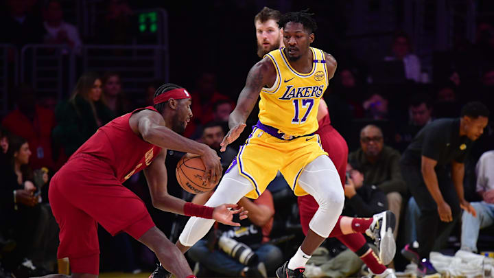 Dec 31, 2024; Los Angeles, California, USA; Los Angeles Lakers forward Dorian Finney-Smith (17) defends against Cleveland Cavaliers guard Caris LeVert (3) during the first half at Crypto.com Arena. Mandatory Credit: Gary A. Vasquez-Imagn Images Dec 31, 2024; Los Angeles, California, USA; Los Angeles Lakers forward Dorian Finney-Smith (17) defends against Cleveland Cavaliers guard Caris LeVert (3) during the first half at Crypto.com Arena. Mandatory Credit: Gary A. Vasquez-Imagn Images