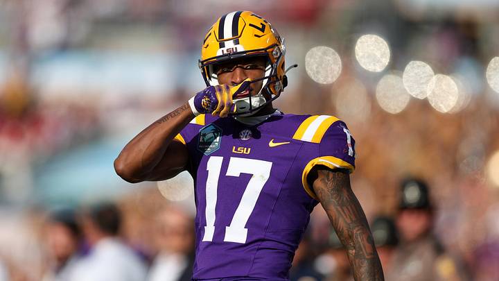 Jan 1, 2024; Tampa, FL, USA;  LSU Tigers wide receiver Chris Hilton Jr. (17) reacts after catching a pass against the Wisconsin Badgers in the fourth quarter during the ReliaQuest Bowl at Raymond James Stadium. Mandatory Credit: Nathan Ray Seebeck-Imagn Images