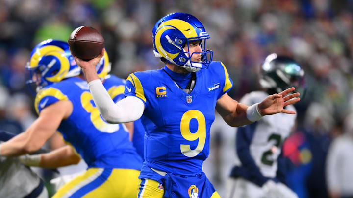 Dec 18, 2025; Seattle, Washington, USA; Los Angeles Rams quarterback Matthew Stafford (9) throws a pass against the Seattle Seahawks in overtime at Lumen Field. Mandatory Credit: Steven Bisig-Imagn Images