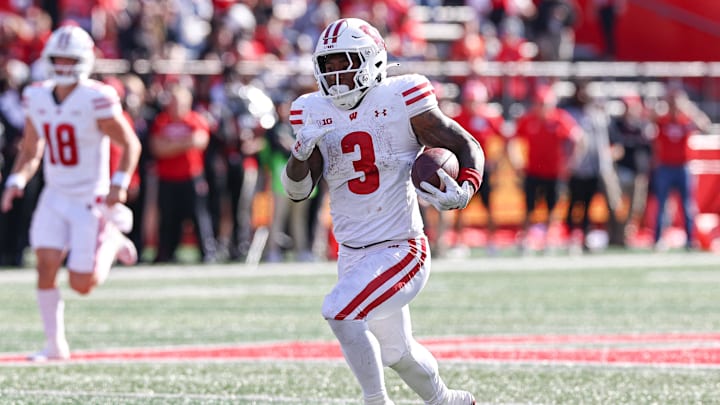 Oct 12, 2024; Piscataway, New Jersey, USA; Wisconsin Badgers running back Tawee Walker (3) rushes for a touchdown against the Rutgers Scarlet Knights during the second half at SHI Stadium. Mandatory Credit: Vincent Carchietta-Imagn Images