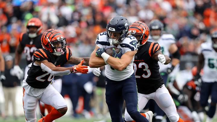 Oct 15, 2023; Cincinnati, Ohio, USA; Seattle Seahawks wide receiver Jake Bobo (19) with a long catch and run as Cincinnati Bengals cornerback DJ Turner II (20) and safety Dax Hill (23) defend during the third quarter at Paycor Stadium. Mandatory Credit: Joseph Maiorana-USA TODAY Sports Oct 15, 2023; Cincinnati, Ohio, USA; Seattle Seahawks wide receiver Jake Bobo (19) with a long catch and run as Cincinnati Bengals cornerback DJ Turner II (20) and safety Dax Hill (23) defend during the third quarter at Paycor Stadium. Mandatory Credit: Joseph Maiorana-USA TODAY Sports