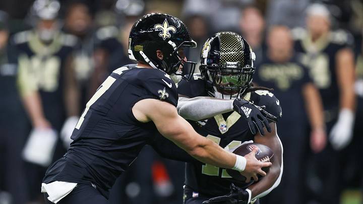 Nov 23, 2025; New Orleans, Louisiana, USA; New Orleans Saints quarterback Taysom Hill (7) hands off to running back Alvin Kamara (41) during the first half against the Atlanta Falcons at Caesars Superdome. Mandatory Credit: Stephen Lew-Imagn Images Nov 23, 2025; New Orleans, Louisiana, USA; New Orleans Saints quarterback Taysom Hill (7) hands off to running back Alvin Kamara (41) during the first half against the Atlanta Falcons at Caesars Superdome. Mandatory Credit: Stephen Lew-Imagn Images