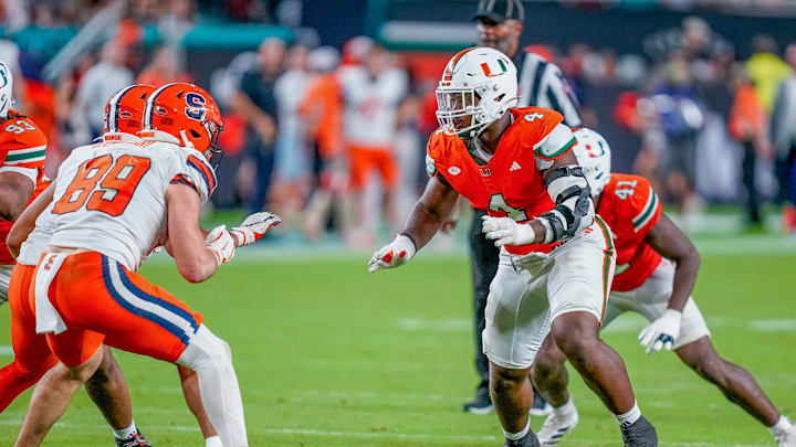 Nov 8, 2025; Miami Gardens, Florida, USA; Miami Hurricanes defensive lineman Rueben Bain Jr. (4) prepares to rush against the Syracuse Orange during the third quarter at Hard Rock Stadium. Mandatory Credit: Jeff Romance-Imagn Images
