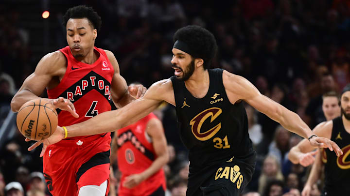 May 3, 2026; Cleveland, Ohio, USA; Toronto Raptors forward Scottie Barnes (4) goes for a loose ball against  Cleveland Cavaliers center Jarrett Allen (31) during the second half of game seven in the first round of the 2026 NBA Playoffs at Rocket Arena. Mandatory Credit: Ken Blaze-Imagn Images