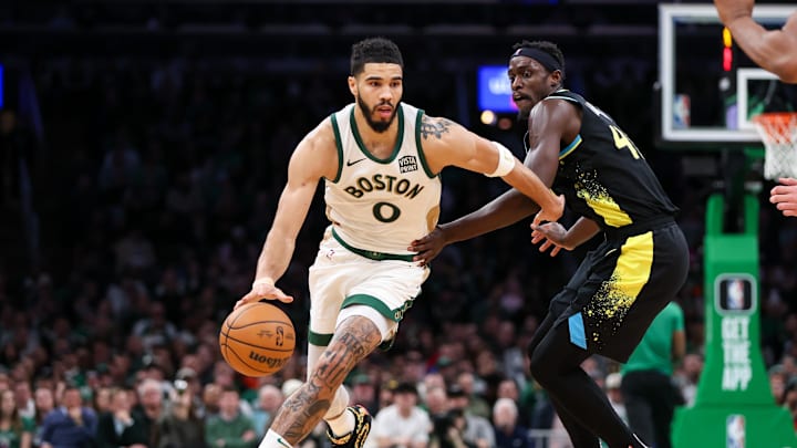 Jan 30, 2024; Boston, Massachusetts, USA; Boston Celtics forward Jayson Tatum (0) drives to the basket vs. Indiana Pacers forward Pascal Siakam.